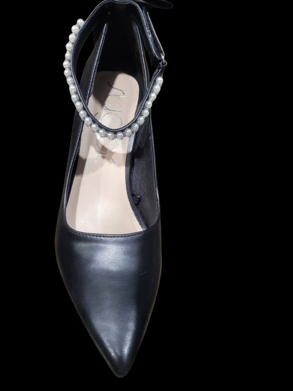 Black heels with pearls and bow